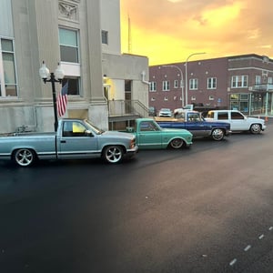 Trucks Lined Up by city hall in downtown marion against the sunset background Marion illinois